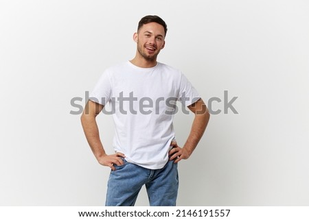 Happy cheerful tanned handsome man in basic t-shirt smile at camera posing isolated on over white studio background. Copy space Banner Mockup. People emotions Lifestyle concept. Model snapshots Royalty-Free Stock Photo #2146191557