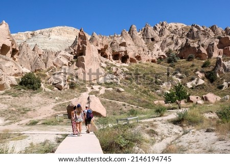 tourists visiting zelve open air museum, archaeological site in cappadocia, turkey Royalty-Free Stock Photo #2146194745