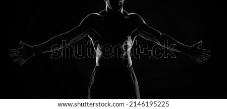 Noname image of a kickboxer on a dark background. The concept of mixed martial arts. MMA Royalty-Free Stock Photo #2146195225