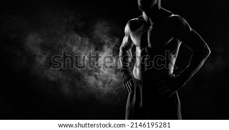 Noname image of a kickboxer on a dark background. The concept of mixed martial arts. MMA Royalty-Free Stock Photo #2146195281