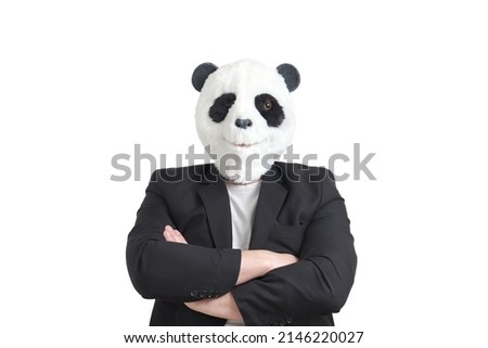 Man wearing a panda mask head and a suit, arms folded, isolated on white background in studio.
