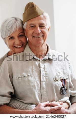 He still looks so handsome in his uniform. Cropped shot of a senior war veteran and his wife. Royalty-Free Stock Photo #2146240027
