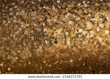 the background is full of gold leaf, gilding Buddha images in Buddhism