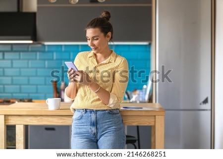 Young woman typing on smart phone