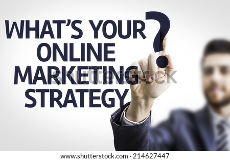 Business man pointing to transparent board with text: What's your Online Marketing Strategy?