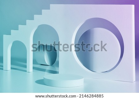 Cylindrical pedestal against background of wall element with steps, archways and round opening