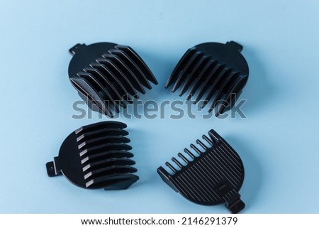Barbershop Hair clippers with nozzle blue background Royalty-Free Stock Photo #2146291379