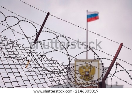 The concept of European and US sanctions pressure on the Russian Federation government. flag of the Russian Federation in barbed wire, sanctions and aggression of Russia. Russian prison Royalty-Free Stock Photo #2146303019
