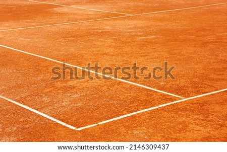 Clay tennis court. Surface outside back and side lines. Diagonal View. Royalty-Free Stock Photo #2146309437
