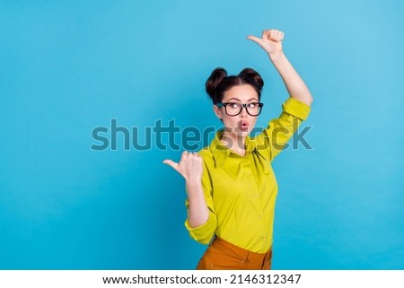 Photo of shocked agent lady demonstrate empty space advertise discounts isolated blue color background