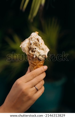 Girl holding ice cream in her hand