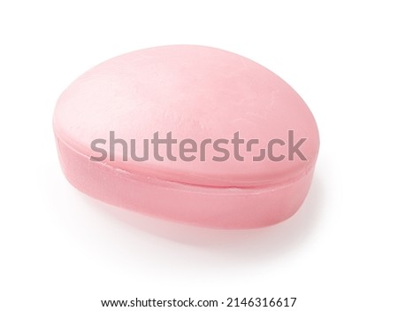 Oval shaped pink bar of soap isolated on a white background. Ellipse floral fragrance soap bar cutout for skin care face and body. Washing hands, purity and toiletries concepts. Top view. Royalty-Free Stock Photo #2146316617