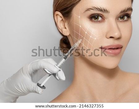 Beauty injections. Lifting lines on a woman's face showing of skin tightening and face contour correction with beauty injections in cosmetology Royalty-Free Stock Photo #2146327355