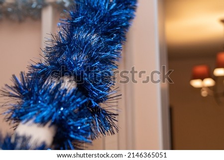 christmas decoration of the house in blue on the background interior