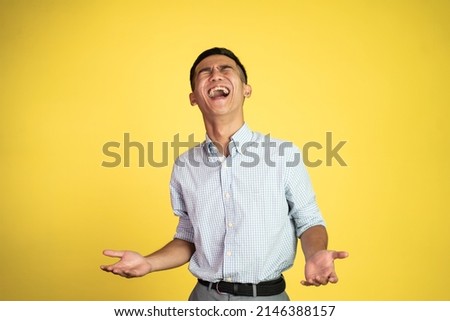 asian businessman laughing naturally over isolated background
