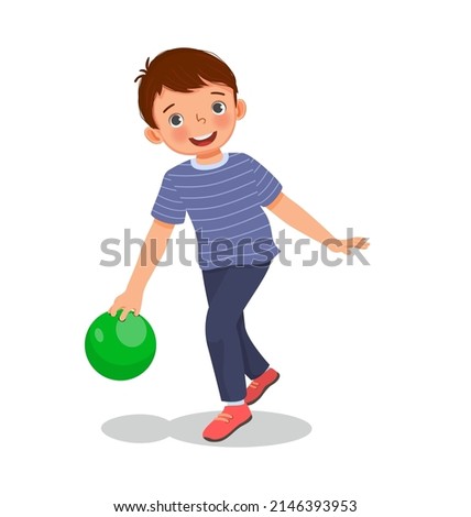 cute little boy playing bowling in the sport club ready to throw the ball