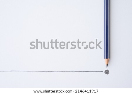 Flat lay of blue colour pencil write line and end point on white paper background copy space. Business conclusion, creative idea, imagination and education concept. Royalty-Free Stock Photo #2146411917