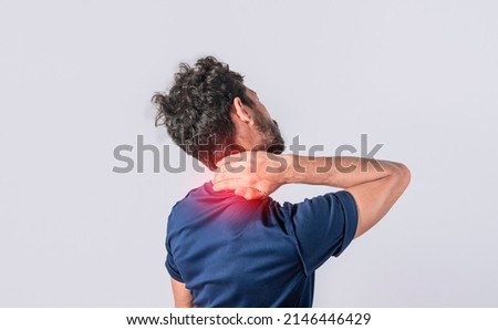 Close up of man with neck pain, a man with neck pain on isolated background, neck pain and stress concept, man with muscle pain Royalty-Free Stock Photo #2146446429
