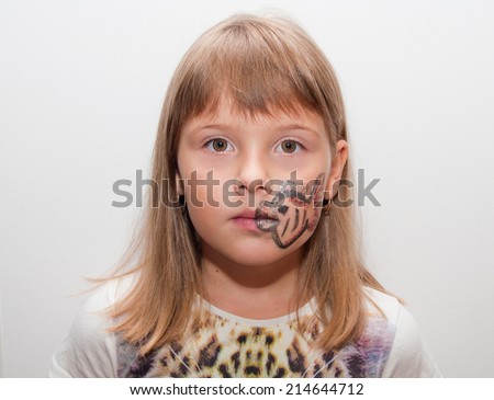 Girl with painted face with fish print