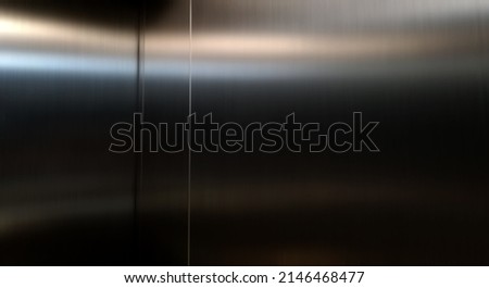 Reflection of light on a shiny metal texture,stainless steel background. Royalty-Free Stock Photo #2146468477