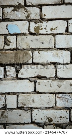 Old white brick wall background. Cement joints, close-up.