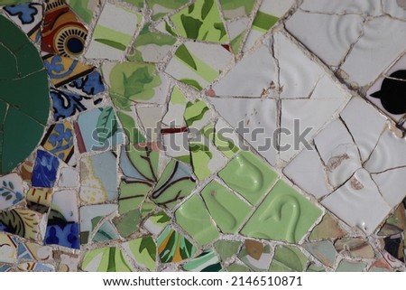 Broken multicolored glass background texture, ceramic tile in park Guell, Barcelona, Spain