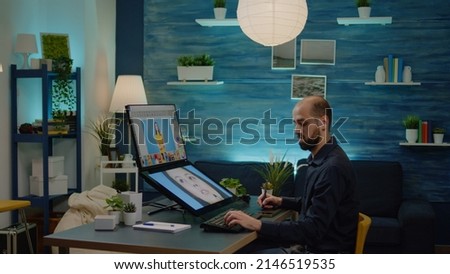Photography artist using graphic tablet with stylus to edit pictures for media project in studio. Photographer doing retouching work on computer with touch screen and professional equipment