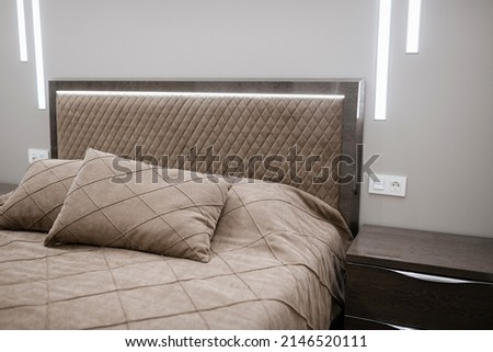 soft or wall cushions on the bed in a bright room with backlight