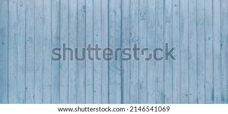 Texture of shabby light blue wooden fence boards as abstract background. Banner