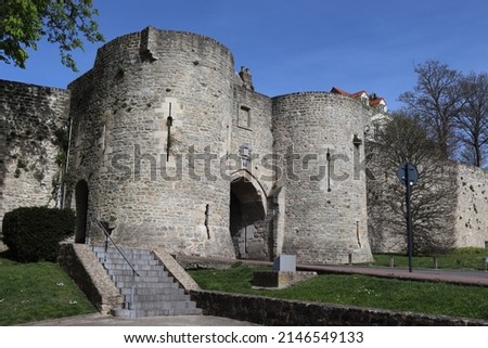 View of Port Gayole gate house and the medieval ramparts of Boulogne-sur-mer, in the Pas de Calais region of northern France. Sunny spring day with blue sky.