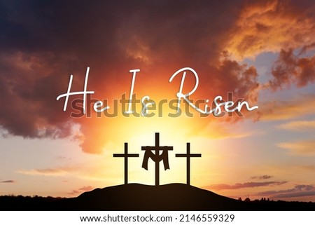 Sunday, He is risen. mount Calvaryand three silhouettes of crosses at sunrise., with text He is risen	