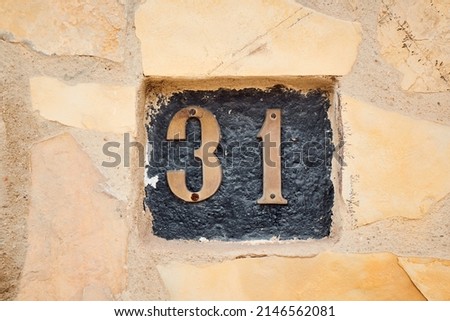 close up photo of a number on a wall