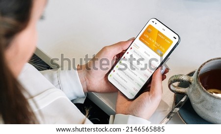 Online payment. Girl holding mobile phone with internet online bank app. Credit card wallet application. Online wallet save money