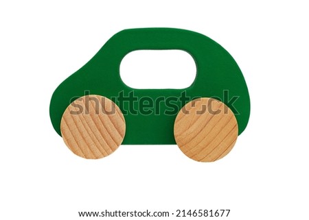 children's toy green wooden car with wheels, isolated on a white background