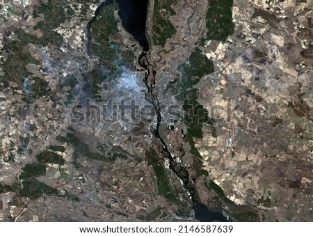 A satellite map of Kiev, Ukraine and surroundings on 23 March 2022 shows smoke rising from several fires Royalty-Free Stock Photo #2146587639