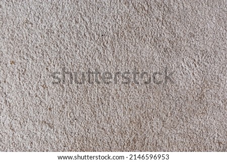 Image of a soft, slightly worn, stained carpet. 