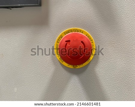 Emergency push button. Mushroom head buttonfor the prevention or reduction of injury damage. Safety in the workplace, safety of simple and complex operating machines.