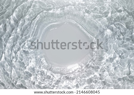 Splash cosmetic moisturizer water micellar toner or emulsion  blue colored abstract background Royalty-Free Stock Photo #2146608045