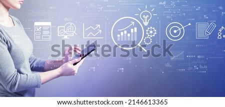 Data Analysis concept with business woman using a tablet computer