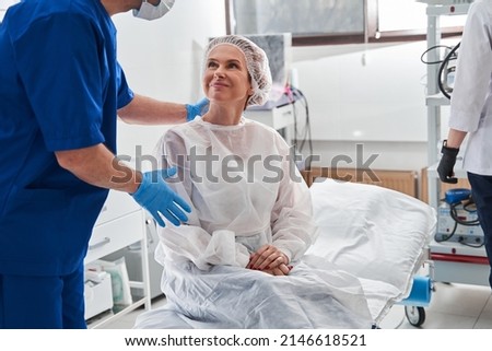 Man calming his patient before the gastroscopy at the modern clinic Royalty-Free Stock Photo #2146618521