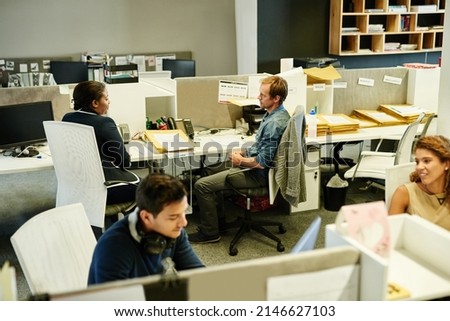 Success is a team effort. Shot of a group of colleagues working together in an office. Royalty-Free Stock Photo #2146627103
