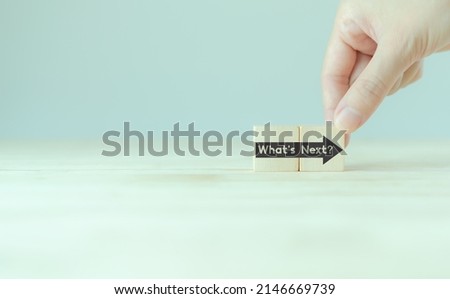 What's next?, business concept. Next step of work, plan, strategies, vision, project implementation, new opportunities and execution.  Putting wooden cubes with What's next?  and forward arrow symbols Royalty-Free Stock Photo #2146669739