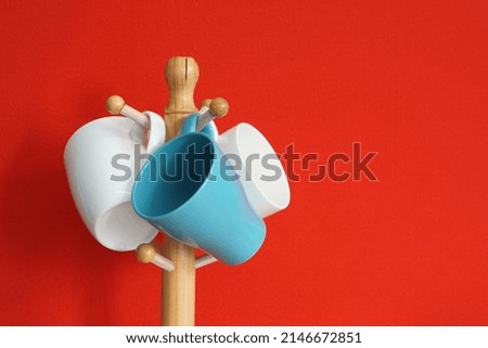 mugs on the table against red background