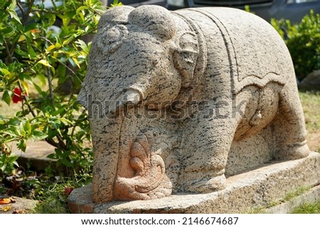 Elephant sculpture carved in the stone at a Hindu temple in Mahabalipuram, Tamilnadu. Royalty-Free Stock Photo #2146674687