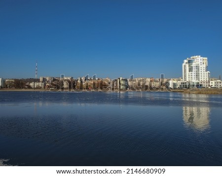 view from the river with the city in the background