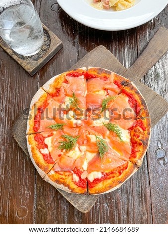smoked salmon pizza on wood tray