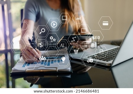 Businessman hand using laptop, tablet and smartphone  in office. Digital marketing media mobile app in virtual icon screen
