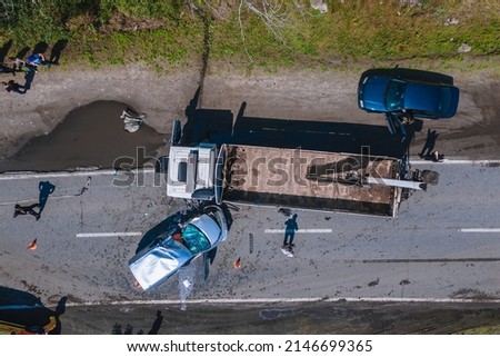 The truck and the car collided on the highway. Strong accident. Traffic accidents on the road. View from above. Traffic jam on the road. DNIPRO, UKRAINE – August 11, 2021 Royalty-Free Stock Photo #2146699365