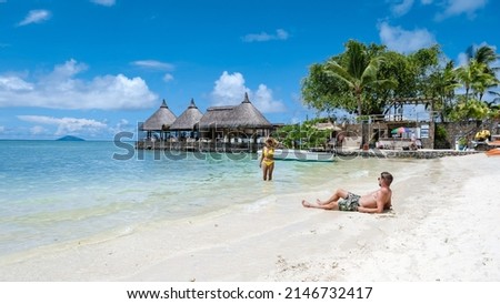 man and woman on a tropical beach in Mauritius, couple on vacation Mauritius