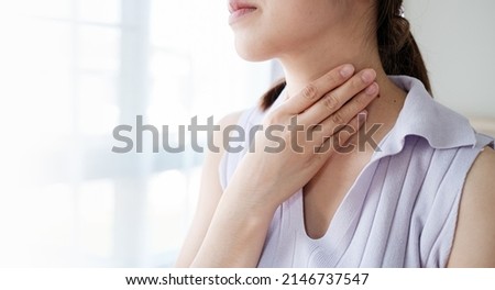 Woman with sore throat inflamed tonsils from influenza symptoms. Healthcare and medical concept Royalty-Free Stock Photo #2146737547